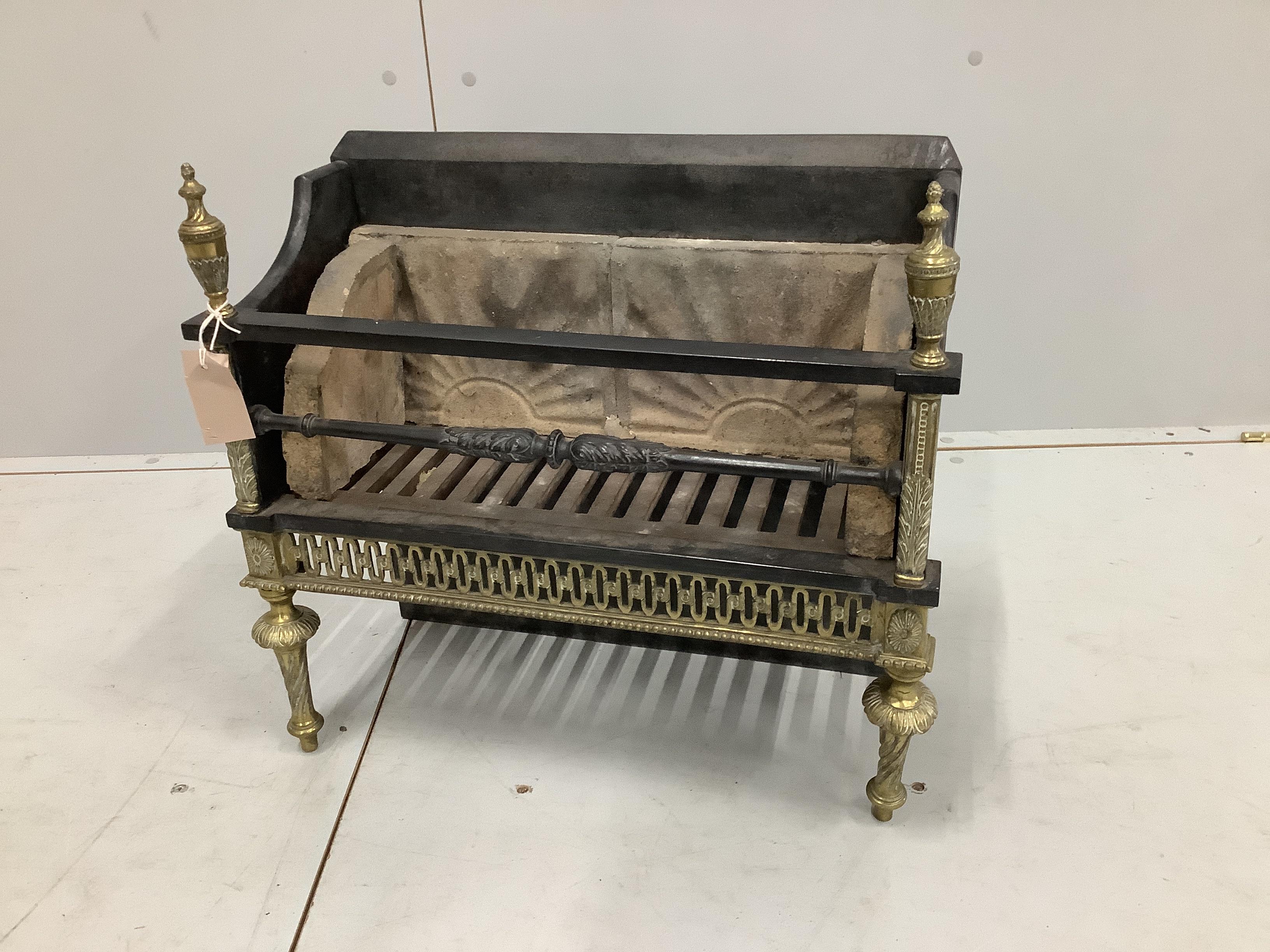 A Regency style brass mounted cast iron fire grate, width 50cm, depth 21cm, height 48cm